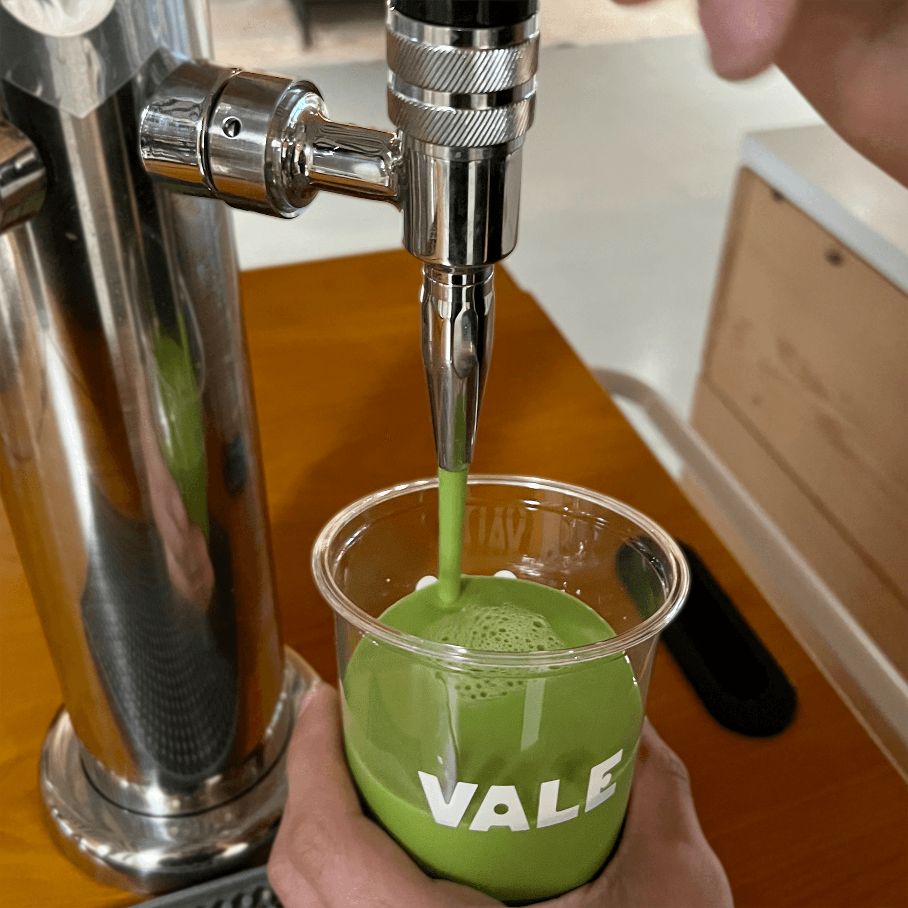 Cold-crafted ceremonial matcha being poured from nitro tap at Vale Matcha & Coffee in Seattle